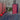 6 Wavelength LED Therapy Panel glowing red on a bedside table beside a person resting in bed