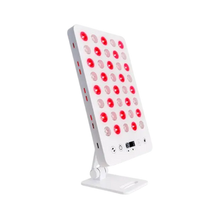 Red light therapy LED panel on an adjustable desktop stand with illuminated red diodes
