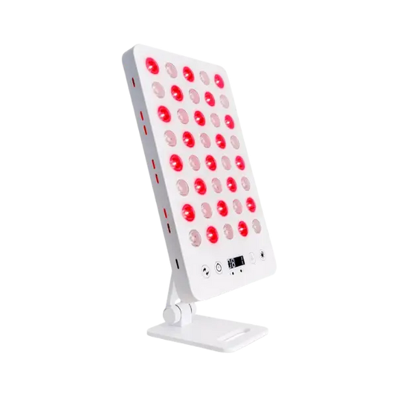 Red light therapy LED panel on an adjustable desktop stand with illuminated red diodes