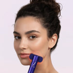 Woman-gliding-purple-Chromaglow-LED-wand-upward-along-her-jawline-with-red-light-therapy-glowing-on-her-skin