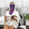 Equinox-Pro-ergonomic-silicone-mask-fit-shown-on-a-woman-reading-comfortably-during-treatment