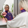 Woman-wearing-Equinox-Pro-LED-mask-on-face,-neck-and-chest-with-warm-glowing-red-light-activated