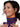 Smiling woman with glowing skin wearing the glowing Luyors Equinox Pro LED neck and chest device